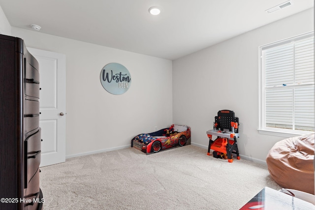 rec room with baseboards, carpet flooring, and visible vents