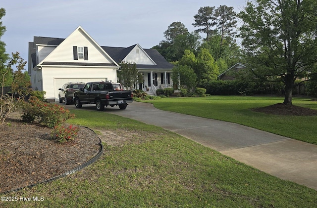 view of front of property with driveway, a front yard, and a garage