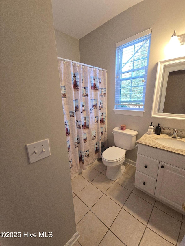 full bath with vanity, toilet, baseboards, a shower with shower curtain, and tile patterned floors
