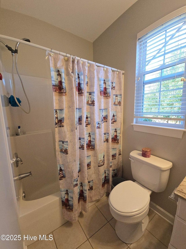 bathroom featuring tile patterned floors, vanity, toilet, and shower / tub combo