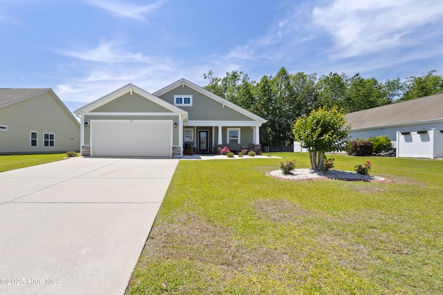 743 Heather Glen Ln, Calabash, NC 28467 - craftsman-style home with an attached garage, concrete driveway, a front yard, and stone siding
