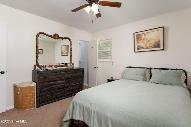 bedroom with carpet floors, a ceiling fan, and baseboards