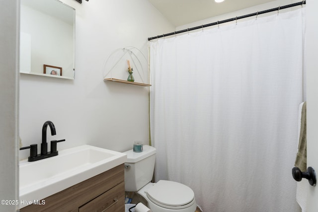 full bathroom featuring vanity and toilet