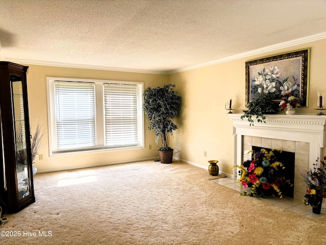 carpeted living room featuring ornamental molding, a textured ceiling, baseboards, and a tiled fireplace
