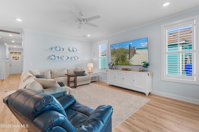 living area featuring a ceiling fan, crown molding, wood finished floors, baseboards, and recessed lighting