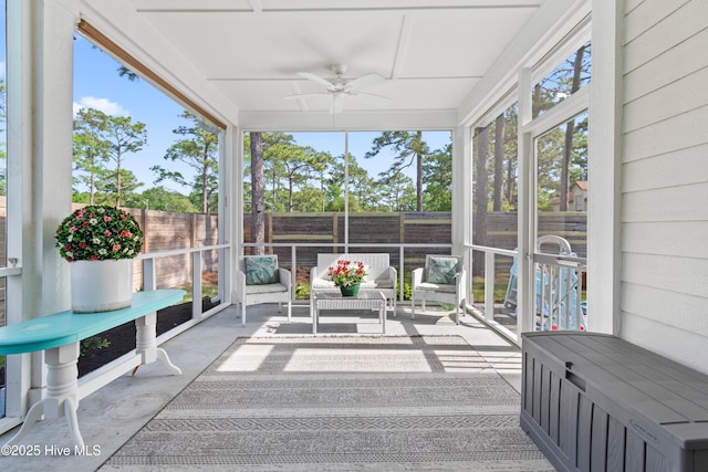 sunroom with a ceiling fan