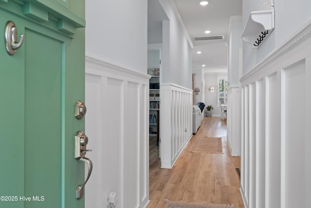 entrance foyer featuring light wood-type flooring, recessed lighting, visible vents, and ornamental molding