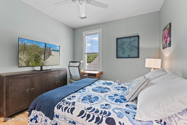 bedroom featuring ceiling fan and wood finished floors
