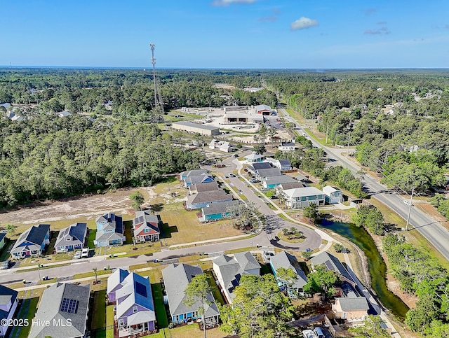 birds eye view of property with a residential view and a forest view