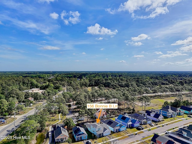 aerial view with a residential view and a forest view