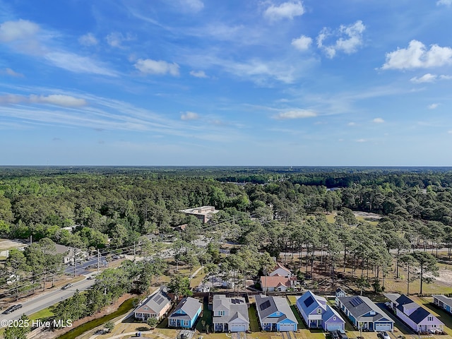 birds eye view of property with a residential view and a forest view