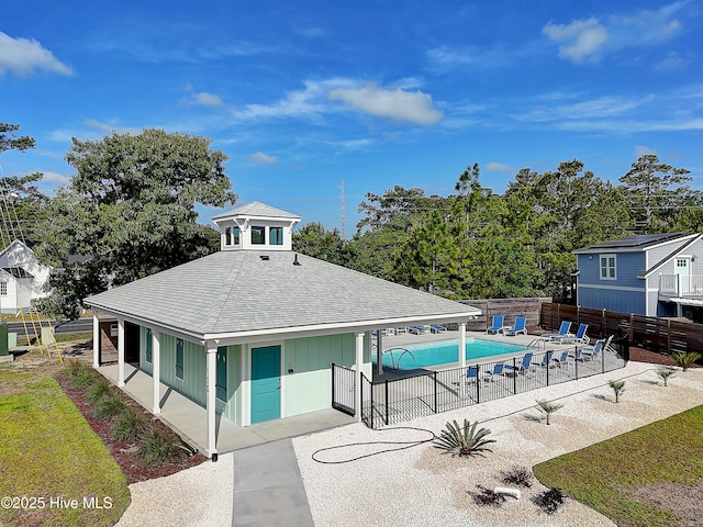 view of property featuring a fenced in pool and a fenced backyard