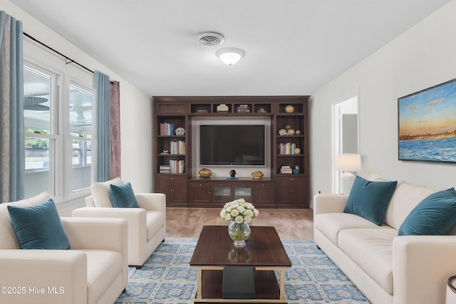 living area featuring visible vents