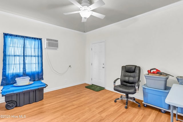 office space with ceiling fan, a wall unit AC, crown molding, wood finished floors, and baseboards