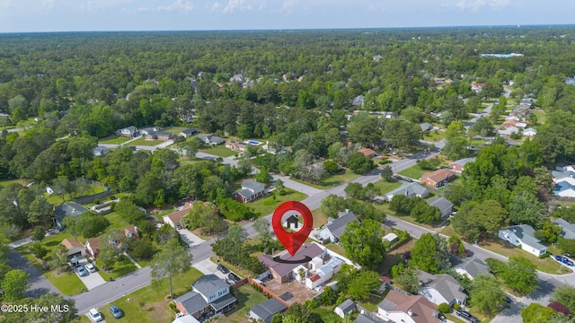 aerial view featuring a residential view and a wooded view
