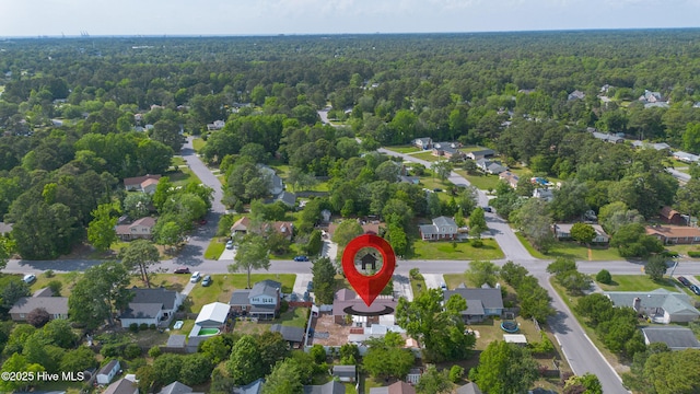 aerial view featuring a view of trees and a residential view