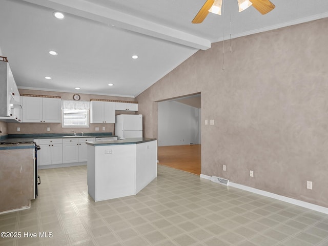 305 Cottontail Run, Newport, NC 28570 - kitchen with visible vents, freestanding refrigerator, electric range, light floors, and vaulted ceiling with beams