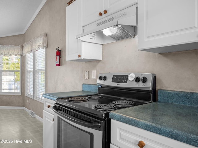 305 Cottontail Run, Newport, NC 28570 - kitchen featuring baseboards, stainless steel range with electric stovetop, under cabinet range hood, and white cabinets