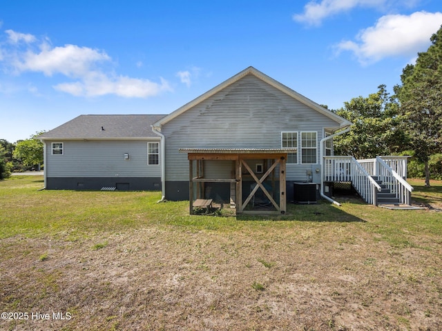 305 Cottontail Run, Newport, NC 28570 - back of property featuring a lawn, a deck, crawl space, and central air condition unit
