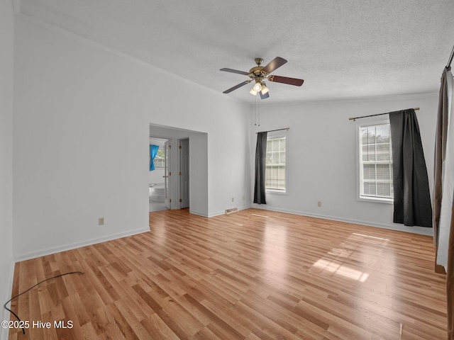 305 Cottontail Run, Newport, NC 28570 - unfurnished room with ceiling fan, light wood-style floors, a textured ceiling, baseboards, and visible vents