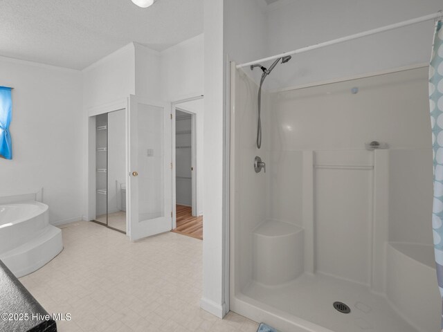 305 Cottontail Run, Newport, NC 28570 - bathroom with a garden tub, a shower stall, and a textured ceiling