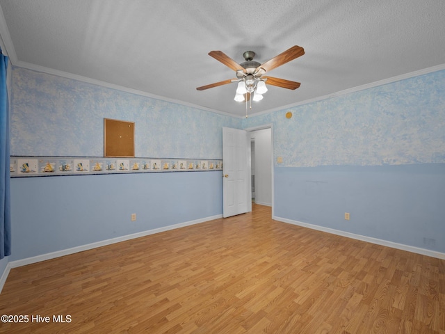 305 Cottontail Run, Newport, NC 28570 - unfurnished room featuring baseboards, a ceiling fan, wood finished floors, and ornamental molding