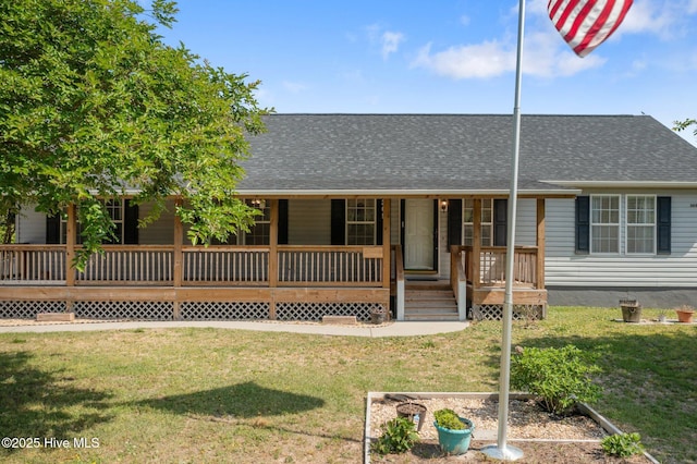 305 Cottontail Run, Newport, NC 28570 - view of front of property featuring roof with shingles, a porch, and a front lawn