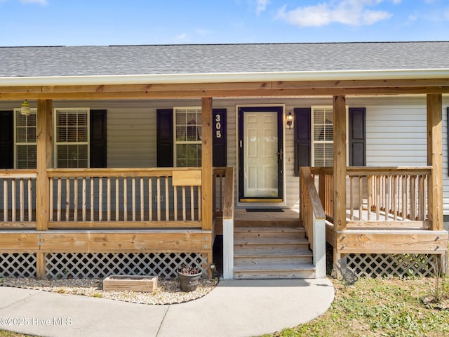 305 Cottontail Run, Newport, NC 28570 - entrance to property featuring a porch and a shingled roof