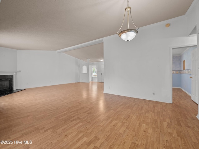305 Cottontail Run, Newport, NC 28570 - unfurnished living room with light wood-style floors, baseboards, crown molding, and a fireplace