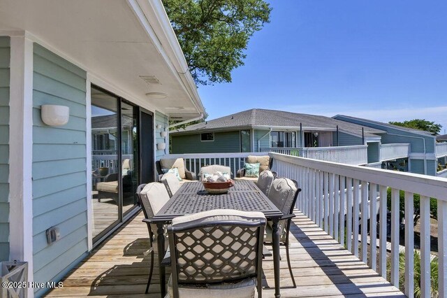 109 Teakwood Dr Unit 802, Carolina Beach, NC 28428 - wooden terrace featuring outdoor dining area