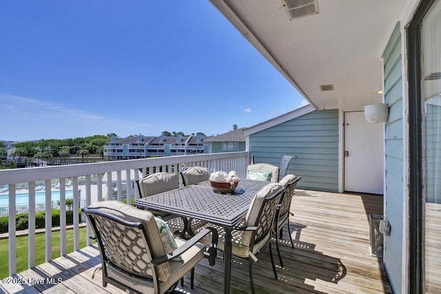 109 Teakwood Dr Unit 802, Carolina Beach, NC 28428 - wooden deck with outdoor dining space