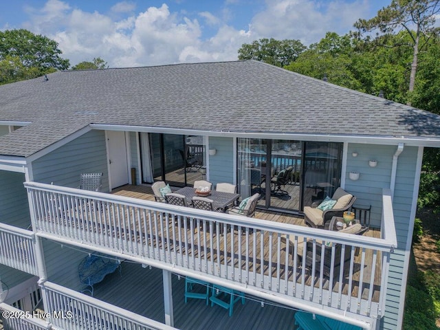 109 Teakwood Dr Unit 802, Carolina Beach, NC 28428 - back of house featuring roof with shingles, outdoor dining area, and a deck