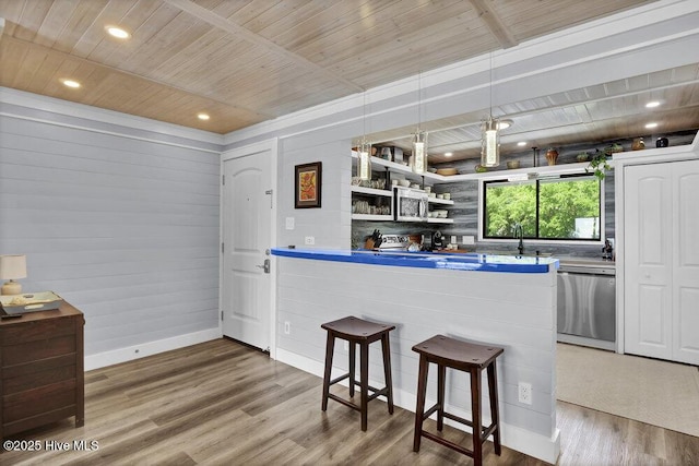 109 Teakwood Dr Unit 802, Carolina Beach, NC 28428 - kitchen featuring stainless steel appliances, a kitchen bar, wood ceiling, wood finished floors, and open shelves