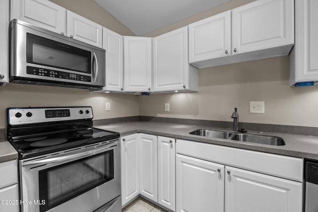308 E Ashe St, Burgaw, NC 28425 - kitchen featuring white cabinetry, dark countertops, stainless steel appliances, and a sink