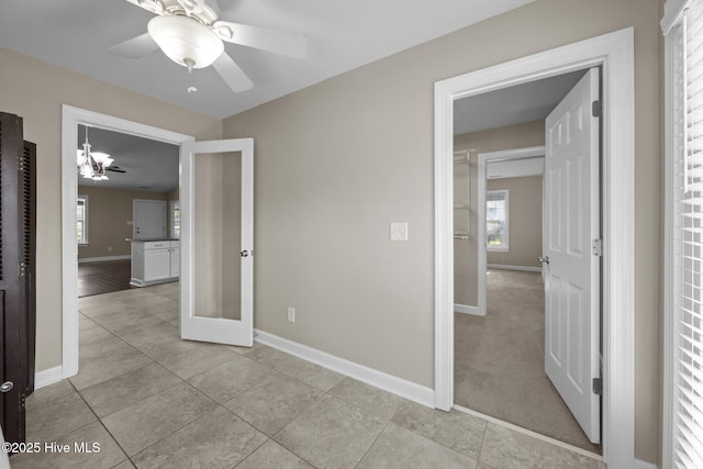 308 E Ashe St, Burgaw, NC 28425 - interior space with light tile patterned flooring, baseboards, and ceiling fan with notable chandelier