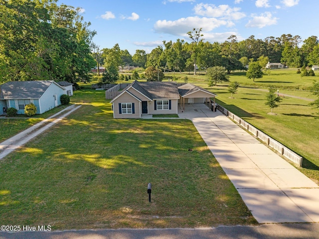 308 E Ashe St, Burgaw, NC 28425 - view of front facade with concrete driveway, a front lawn, and a carport