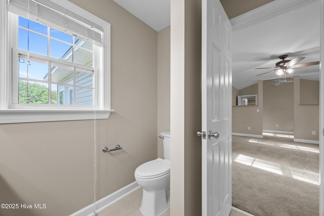308 E Ashe St, Burgaw, NC 28425 - bathroom with toilet, vaulted ceiling, baseboards, and ceiling fan