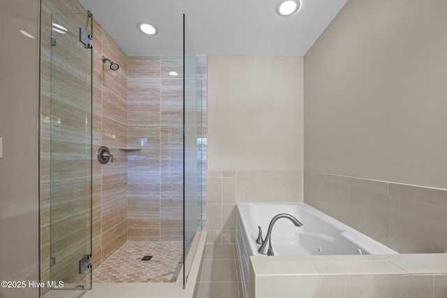 308 E Ashe St, Burgaw, NC 28425 - bathroom with a stall shower, a tub with jets, and recessed lighting