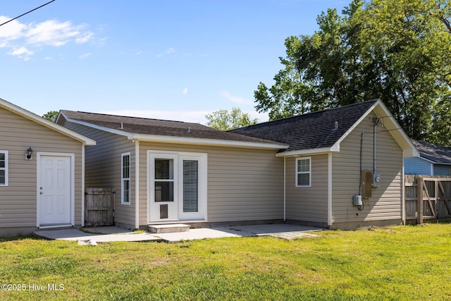 308 E Ashe St, Burgaw, NC 28425 - rear view of house with a yard, fence, and a patio