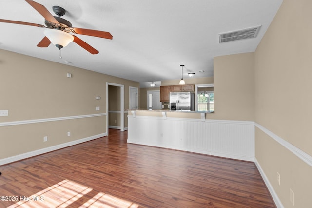 2202 Sweet Bay Dr Unit B, Greenville, NC 27834 - unfurnished living room with wood finished floors, ceiling fan, and baseboards