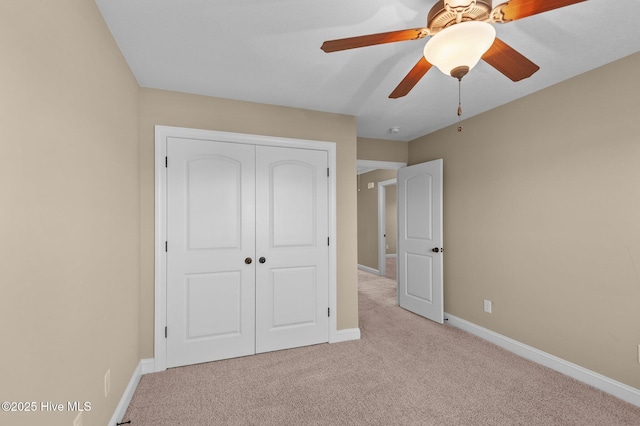 2202 Sweet Bay Dr Unit B, Greenville, NC 27834 - unfurnished bedroom with carpet floors, a closet, baseboards, and ceiling fan
