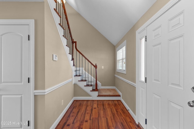 2202 Sweet Bay Dr Unit B, Greenville, NC 27834 - foyer featuring wood finished floors, vaulted ceiling, baseboards, and stairway