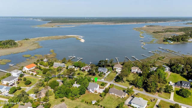 birds eye view of property featuring a water view and a residential view