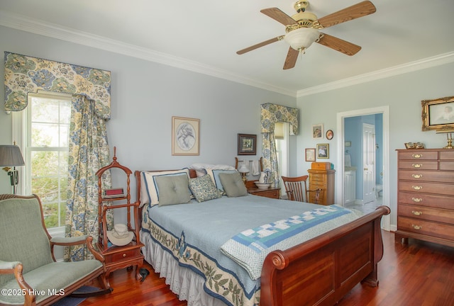 bedroom featuring ornamental molding, ensuite bathroom, and dark wood-style flooring
