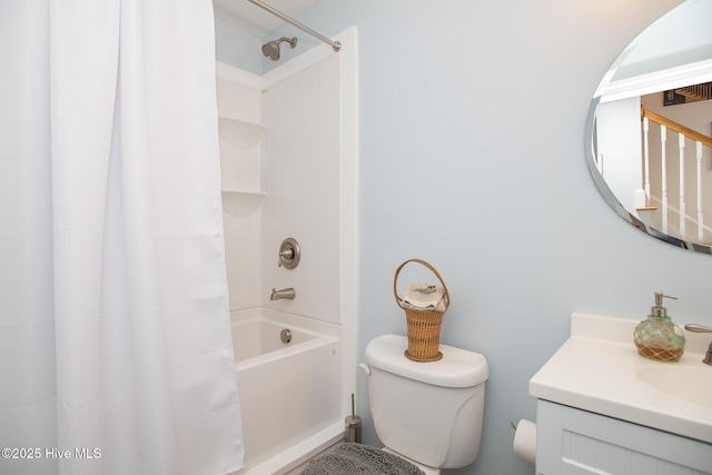 full bath with vanity, shower / bath combo, and toilet