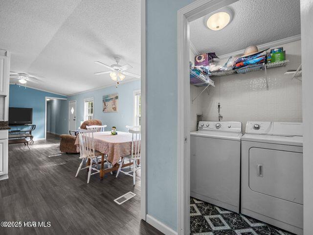 336 Old Folkstone Rd, Holly Ridge, NC 28445 - laundry room with separate washer and dryer, laundry area, a ceiling fan, and a textured ceiling