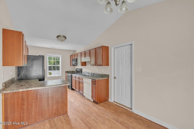189 Queens Haven Rd, Hubert, NC 28539 - kitchen featuring a sink, brown cabinets, vaulted ceiling, black appliances, and light wood-type flooring