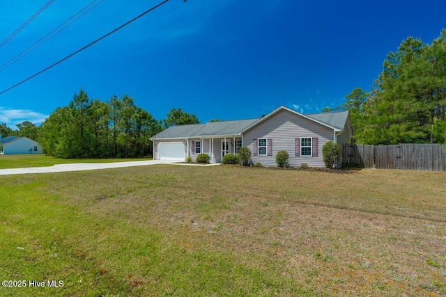189 Queens Haven Rd, Hubert, NC 28539 - ranch-style house with concrete driveway, a front yard, a garage, and fence