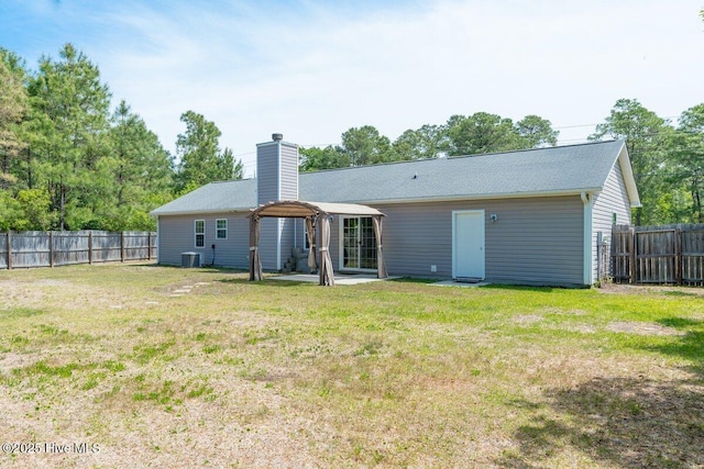 189 Queens Haven Rd, Hubert, NC 28539 - back of house with a yard, a chimney, and a fenced backyard