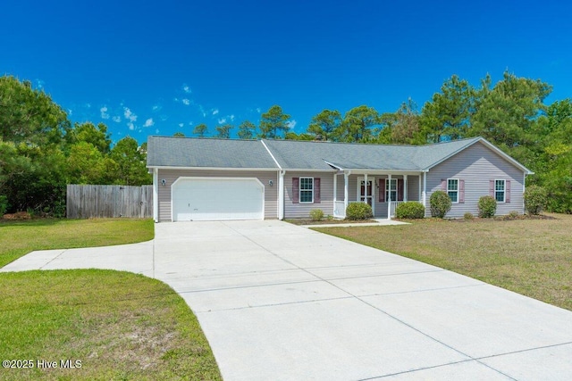189 Queens Haven Rd, Hubert, NC 28539 - ranch-style house with an attached garage, a porch, fence, and a front yard